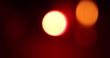 A blurry image of a red light on a black background video