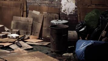 Cluttered storage filled with boxes and trash bags in a dim space video
