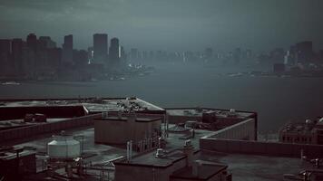 Misty skyline view over rooftops in a vibrant urban setting during twilight video