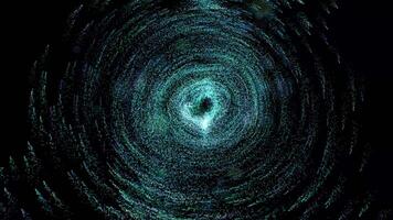 The birth of a galaxy. Many small glowing light green particles move in a circle to form a single space video