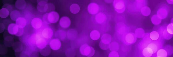 Vibrant purple bokeh lights create a festive atmosphere for evening events and celebrations outdoors photo