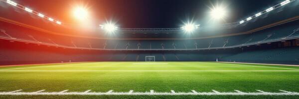 Brightly lit soccer stadium ready for evening match with manicured grass and goalpost in view photo