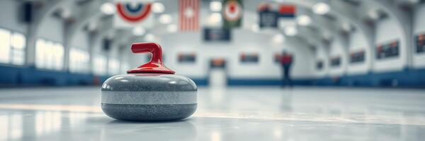 Curling stone rests on the ice at a sports facility during a local curling tournament in winter season photo