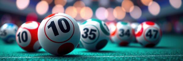 Colorful lottery balls rolling on green surface with soft blurred lights in the background photo