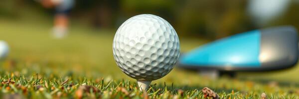Golf ball ready to be struck on a well-manicured course surrounded by lush greenery photo