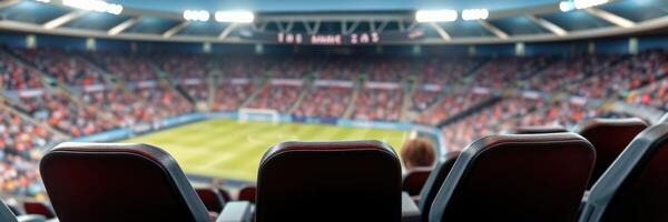 Spectators await the excitement of a live football match in a bustling stadium filled with fans in a vibrant atmosphere photo