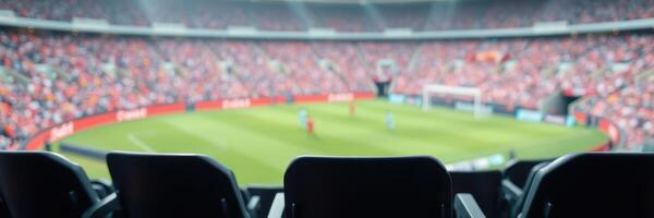 Spectators enjoy an exciting soccer match at a packed stadium during a sunny afternoon photo