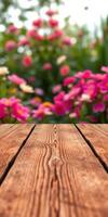 Beautiful garden blooms with wooden surface in foreground during a sunny day photo