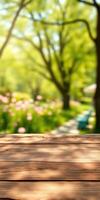Peaceful garden setting with blooming flowers and soft sunlight illuminating a wooden table photo