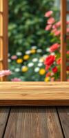 Relaxing wooden table in a vibrant flower garden with blooming roses and daisies during sunny day photo