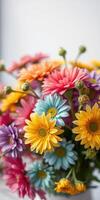 Colorful bouquet of flowers with vibrant petals arranged beautifully in a vase on a table photo