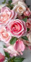Beautiful bouquet of pink roses arranged with soft petals and lush green leaves in a warm indoor setting photo