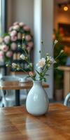 Elegant floral arrangement in a bright cafe with soft natural lighting during mid-morning hours photo