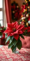 Red poinsettia centerpiece enhances festive atmosphere in cozy room adorned for celebration photo