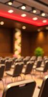 Conference hall with empty chairs prepared for an upcoming event in a modern venue photo