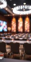 Conference hall set for a corporate event with modern decor and audiovisual setup during daytime photo
