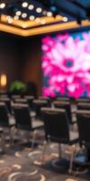 Elegant conference room with a vibrant floral backdrop, perfect for professional gatherings and presentations photo