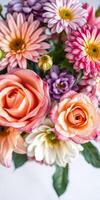 Bright bouquet of mixed flowers including roses, daisies, and chrysanthemums arranged beautifully in a vibrant display photo