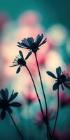 Silhouetted flowers against a blurred, colorful background in a serene setting during twilight photo