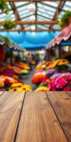Brightly colored flowers and market activity under a vibrant canopy in a bustling flower market setting photo