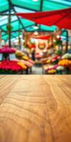 Vibrant flower market bustling with life and colors during a sunny afternoon in a lively urban setting photo