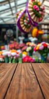 Vibrant flower market with colorful blooms and rustic wooden table in focus during a sunny day photo