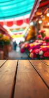 Vibrant flower market in colorful setting with wooden table in foreground during a festive afternoon photo