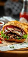 Juicy hamburger topped with fresh ingredients served in a rustic setting with crispy fries nearby photo