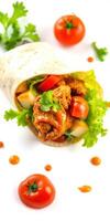 Tasty chicken wrap filled with fresh vegetables and vibrant tomatoes on white background photo