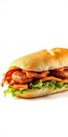 Delicious sub sandwich filled with lettuce, tomatoes, bacon, and sausage on a soft white roll photo