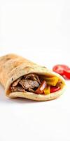 Delicious wrap filled with grilled meat and fresh vegetables served on a clean surface photo