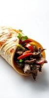 Delicious beef wrap with fresh vegetables and herbs served on a white background photo