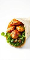 Delicious chicken wrap filled with fresh greens and herbs served on plain background photo