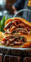 Delicious stacked sandwich with savory meats served alongside crispy fries in a vibrant setting photo