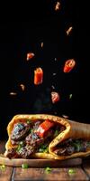 Delicious grilled steak wrap garnished with fresh vegetables and spices on a wooden surface photo