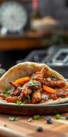 Delicious grilled chicken wrapped in pita with fresh vegetables served on a wooden table photo