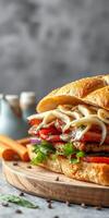 Delicious sandwich with fresh ingredients served on a wooden board in a cozy setting photo