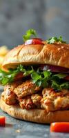 Delicious chicken sandwich with fresh vegetables and a golden bun served on a rustic table photo