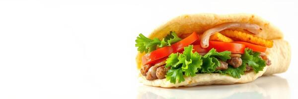 Delicious taco filled with fresh vegetables and savory meat served on a white background photo