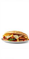 Delicious sandwich filled with crispy chicken, melted cheese, and fresh vegetables on a white plate photo