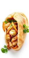 Delicious grilled chicken wrapped in fluffy flatbread with fresh herbs and colorful vegetables photo