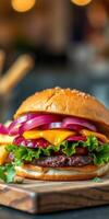 Delicious burger with fresh ingredients and golden fries served in a cozy dining setting photo