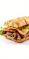 Delicious sandwich with grilled meat and cheese on a soft bun featuring fresh herbs photo