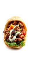 Savory flatbread wrap filled with seasoned meat, fresh vegetables, and creamy sauce in a bright setting photo