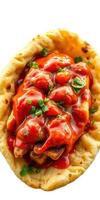 Delicious street food with crispy bread topped with savory sauce and garnished with fresh herbs in vibrant colors photo