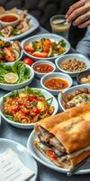 Diverse range of Middle Eastern dishes served on a table in a vibrant restaurant setting during dinner time photo