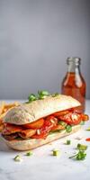 Delicious sandwich with grilled chicken, fresh toppings, and a side of golden fries served with a drink photo