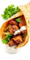 Tasty wrap filled with marinated meat, fresh vegetables, and herbs ready to be enjoyed at mealtime photo