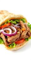 Deliciously prepared wrap filled with savory meat, fresh vegetables, and flavorful sauces in a casual dining setting photo
