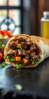 Delicious wrap filled with seasoned meat, fresh vegetables, and savory sauce in a cozy setting photo